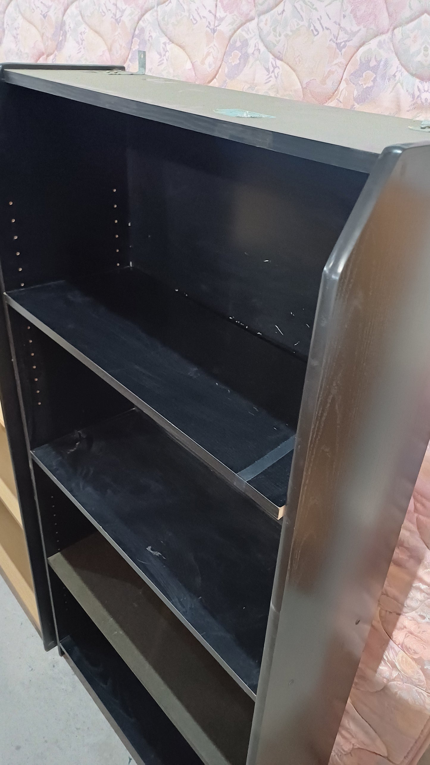 Black four shelving unit