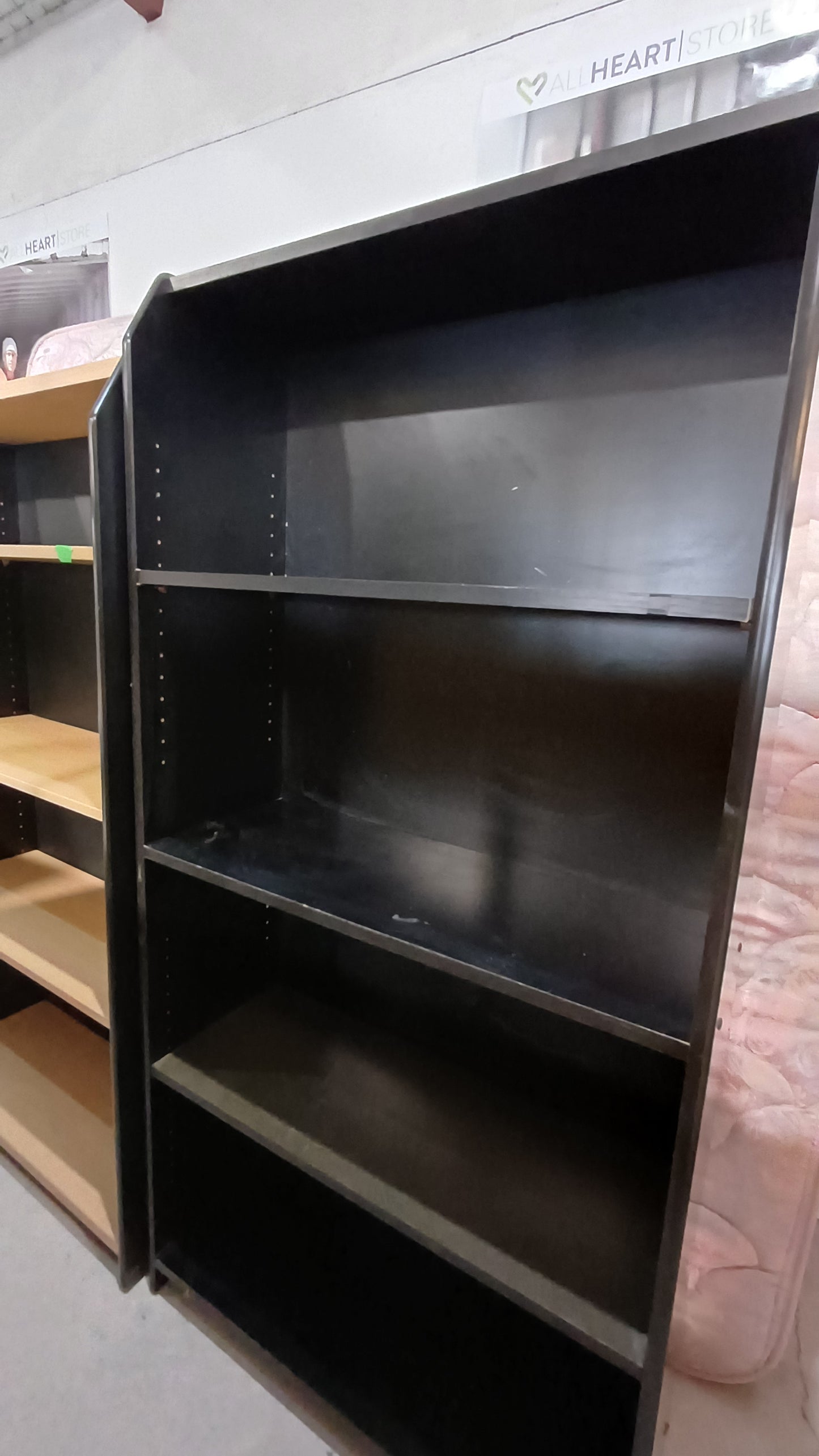 Black four shelving unit